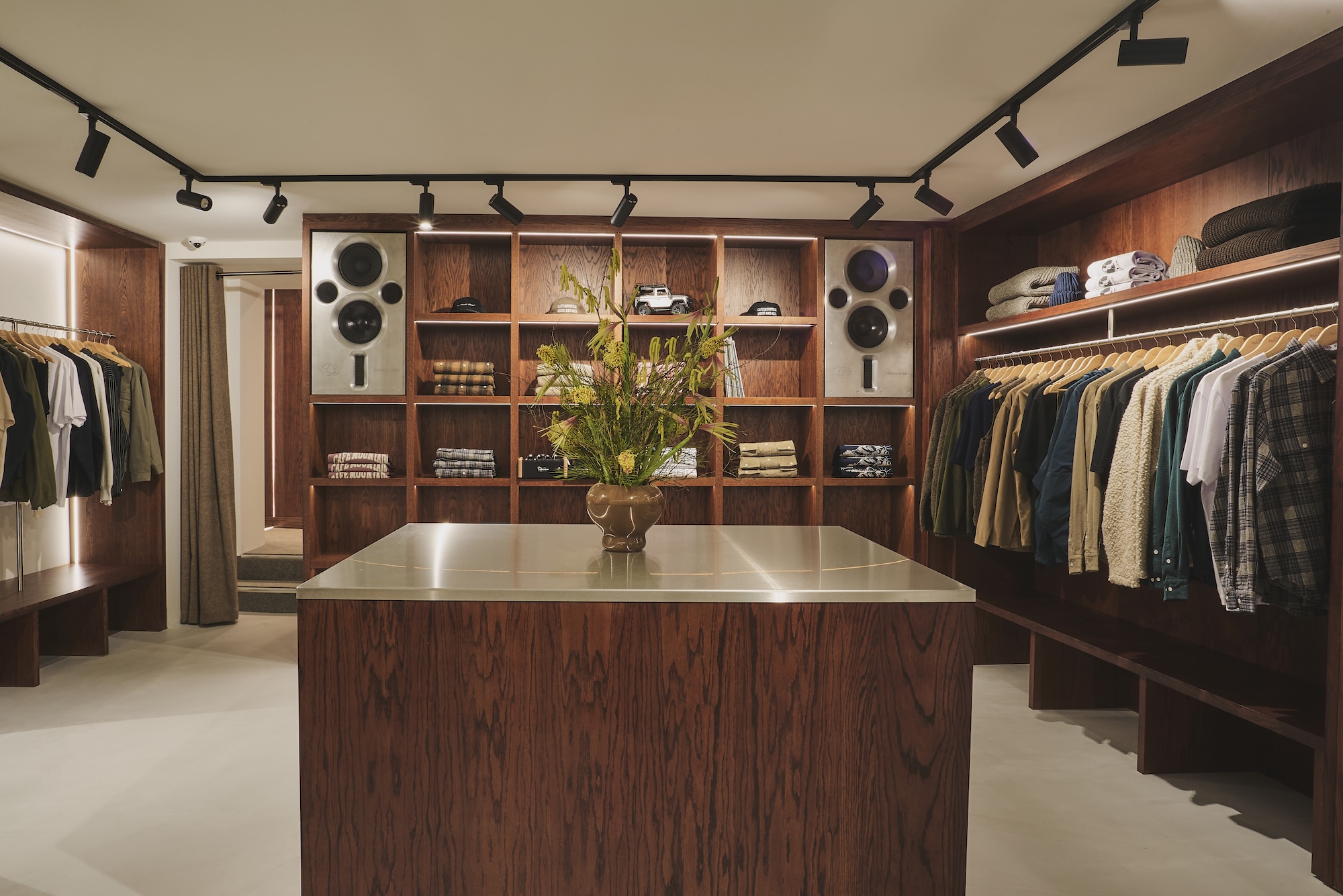 Bespoke dark timber retail displays and central counter at Café Mountain in Newcastle